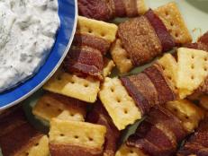 These are inspired by the snacks I ate growing up in the South: crunchy crackers wrapped in crispy bacon and served with a creamy herb dip. These are always a hit whenever I serve them!