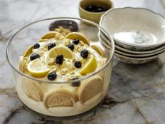 Ree recommends using a glass bowl for this no-cook dessert, to display the arrangement of the shortbread cookies, and the thick layer of lemony cream.