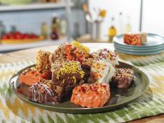 Crispy rice cereal treats are as American as apple pie and PB&J sandwiches. The classic chewy treats are so simple, it's easy to jazz them up for any occasion. This version is for the lovers of the popular fall flavor, pumpkin pie spice. Add a little razzle dazzle of chocolate, sprinkles and my favorite nut, and you have nostalgia and nouveau all in one sweet treat!