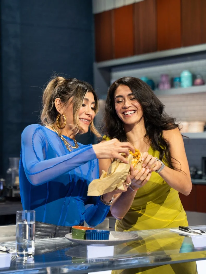 Judges Bricia Lopez and Daniela Soto-Innes tasting while host Eric Adjepong watches (L to R), as seen on Food Network's Alex Vs. America