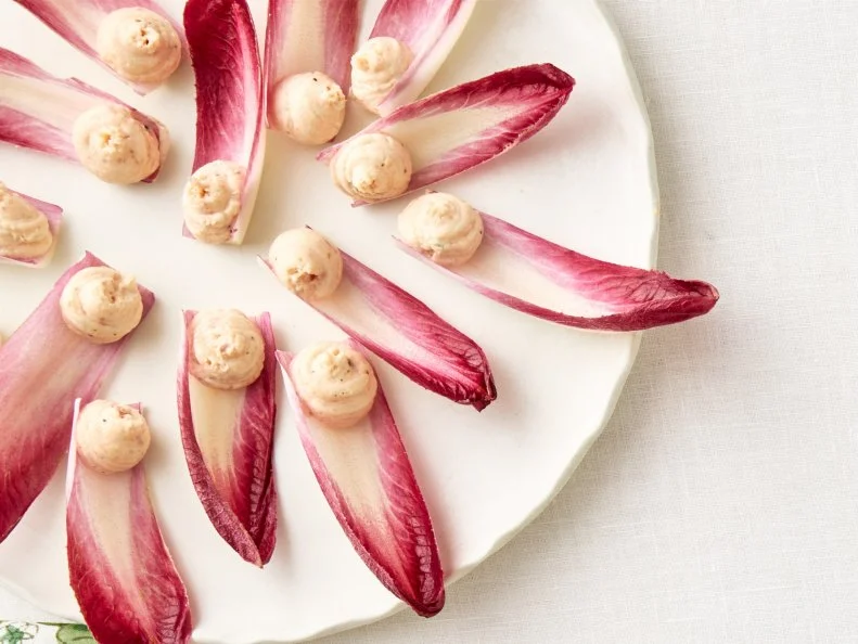 Endive with Smoked Salmon\, Bratwurst Rolls\, Deviled Eggs with Tzatziki\, Prosciutto-Wrapped Pears\, Spiced Crispy Chickpeas\, and Smashed Tater Tot Crostini. Appetizers.