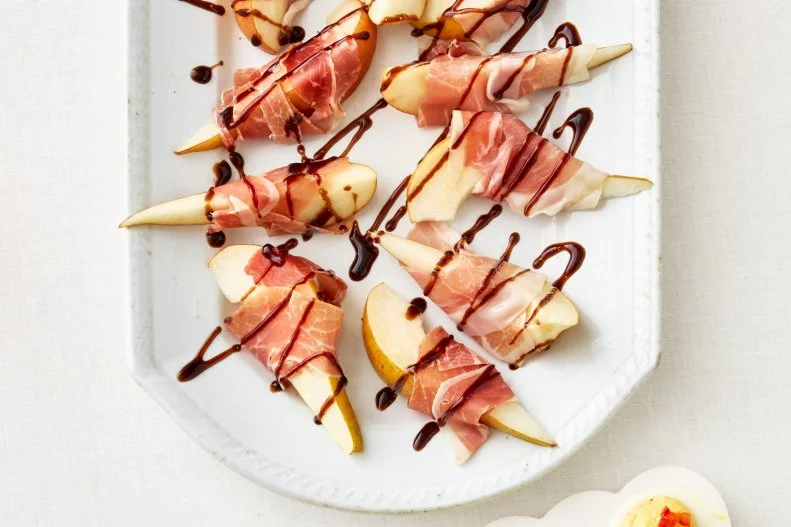 Endive with Smoked Salmon\, Bratwurst Rolls\, Deviled Eggs with Tzatziki\, Prosciutto-Wrapped Pears\, Spiced Crispy Chickpeas\, and Smashed Tater Tot Crostini. Appetizers.