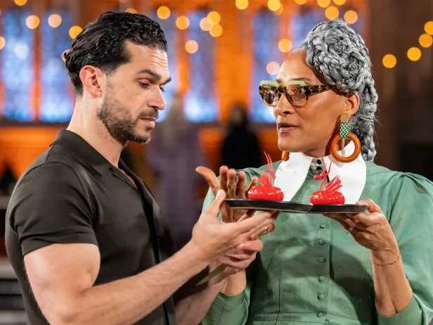 Judge Carla Hall and Judge Jozef Youssef during judging of contestants Jenny Chambers and Alex Madrigal’s showpiece titled ‘Born of Fire and Loyalty”, as seen on Harry Potter: Wizards of Baking, Season 2.