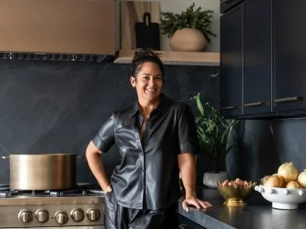 Homeowner(s) pose for a portrait in the kitchen of the Lofaso home, as seen on Sin City Rehab, Season 1.