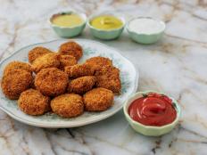 Homemade chicken nuggets are perfect for a snack or an appetizer, or for a weeknight dinner if you serve them with a salad. Ree gives the chicken extra flavor by mixing it with minced green onions.