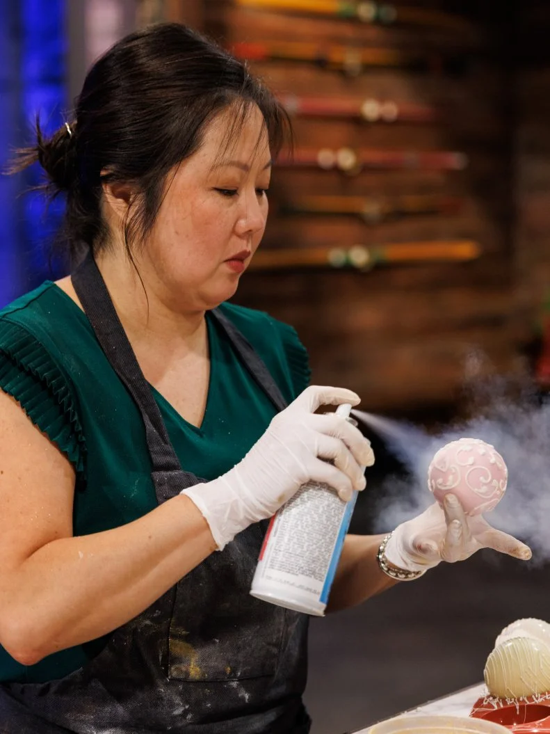 Contestant Liu Mei-Antonio prepares her challenge 1 dish, as seen on Sweet Empire, Season 1