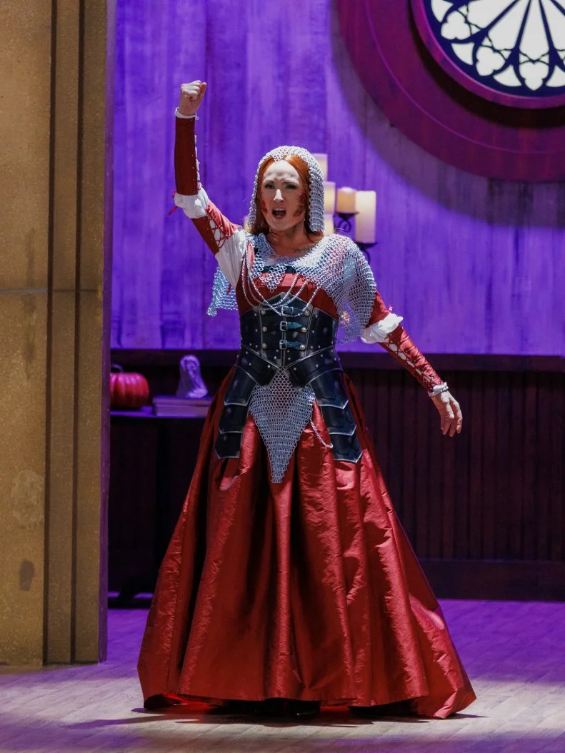 Judge Stephanie Boswell enters, as seen on Halloween Baking Championship, Season 11.