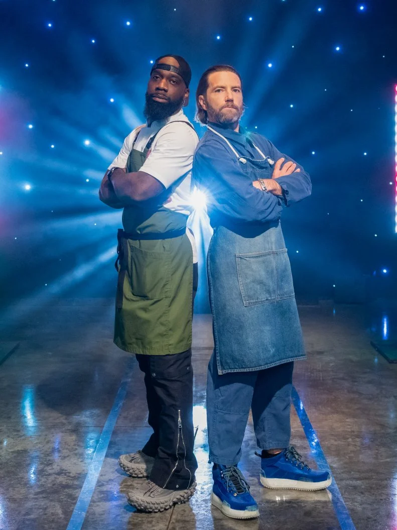 Contestants Tobias Dorzon and Marcel Vigneron pose on set, as seen on Tournament of Champions Holiday, Season 1.