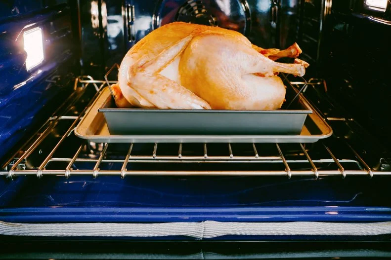 Close-up of turkey roasting in oven
