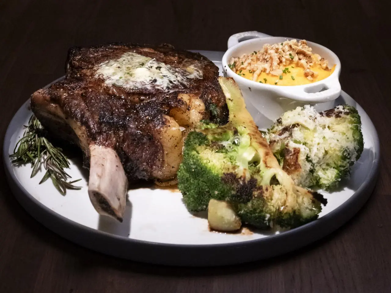 Pepper-Crusted Cowboy Rib Eye with Anchovy-Blue Cheese Butter and