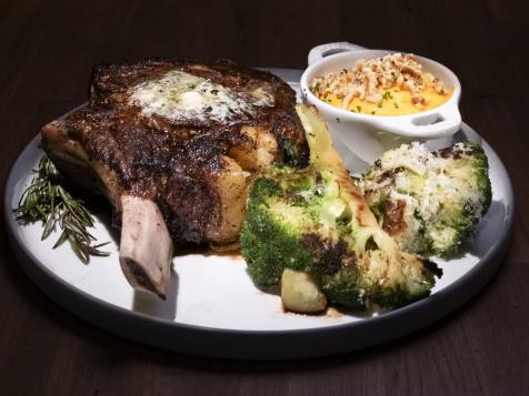 Pepper-Crusted Cowboy Rib Eye with Anchovy-Blue Cheese Butter and Rosemary Smoke