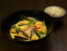 Curries are known all over the world from India to Thailand to the Caribbean. This is a Thai-inspired version with a mildly sweet yellow curry, mussels and shrimp, served with crispy yellowtail snapper and a side of jasmine rice. Lime leaf, Thai basil, turmeric and lemongrass add a brightness that wonderfully complements this richly-flavored seafood curry.