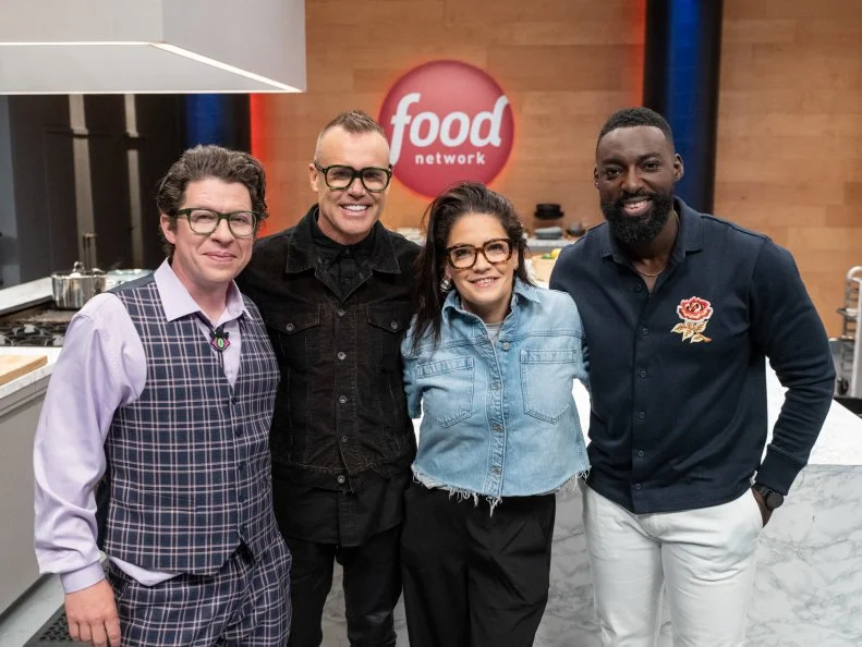 Contestants Justin Warner, Brian Malarkey and Maria Mazon with host Eric Adjepong, as seen on Wildcard Kitchen, Season 3.