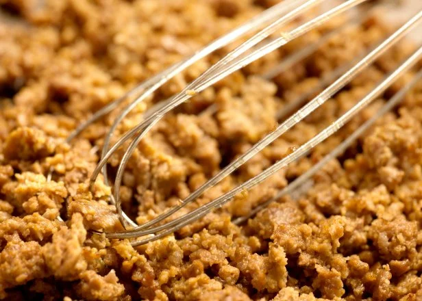 stiring minced meat in a frying pan