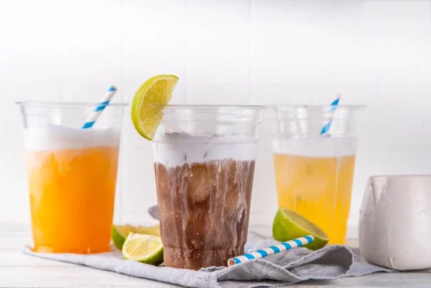 Dirty soda, soda and cream alcohol free mocktail. Iced sweet soda drink with non-dairy creamer, trendy cold summer cocktail, copy space