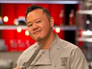 Chef Jet Tila threatens with a knife , as seen on Food Network's Cutthroat Kitchen, Season 3.