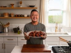 Jet Tila holding Sesame Chicken, as seen on Ready Jet Cook, Season 3.