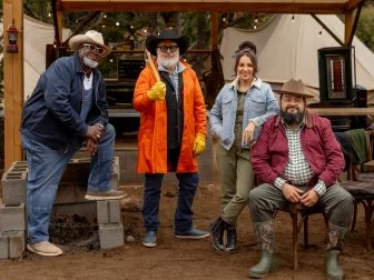 Host Andrew Zimmern with Judges Moe Casen, Ernest Servantes and Jess Pryles during the  Big Burn: The Core Four Cook-Off challenge as seen on Pit Masters, Season 1.