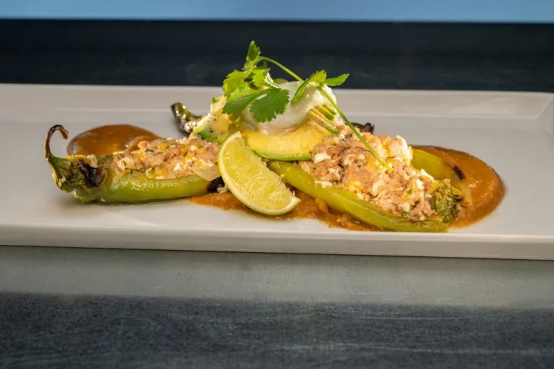Round 1 dish made by Jenni Ford, pork and cheese stuffed Hatch green chile with roasted jalapeno butternut squash puree, as seen on Alex vs America, Season 4.
