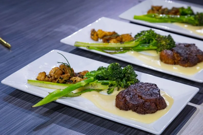 Contestant Courtney Lindsay's round 2 Dish "Filet of Lion’s Mane with Charred Broccolini & Lump Crab in a Truffle & Parm Potato Puree", as seen on Alex vs America, Season 2.