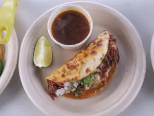 Quesabirria as prepared by Chef/Owner Tony Avila at One Taco in Austin, Texas, as seen on Food Network's Triple D Nation, season 8.