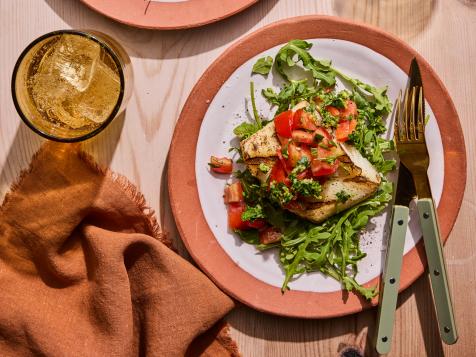 Grilled Halibut Steaks on a Bed of Arugula with Tomato Salad and Gremolata