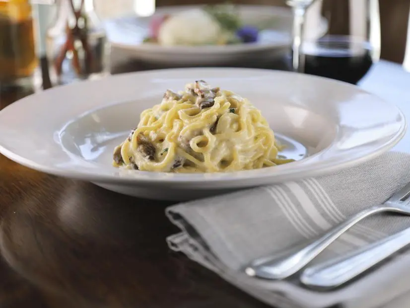 Carbonara as prepared by Chef Soerkeas at Mezzaluna Pastaria in Bentonville, Arkansas as seen on Food Network's Diners Drive-Ins and Dives, season 43.
