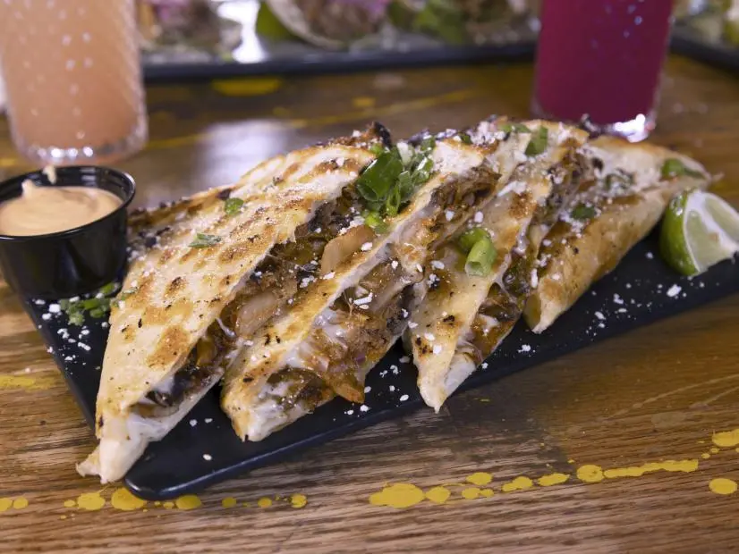 Kimchi Quesadilla as prepared by Chef/Owner Andres Velez at Pig Latin Cocina in Colorado Springs, Colorado, as seen on Food Network's Triple D Nation, season 8.