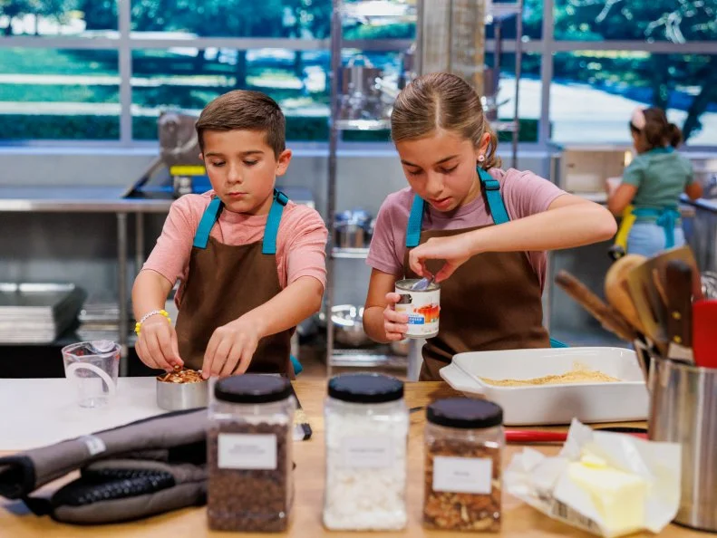Contestants Maci and Emmett Sheets, baking process, as seen on Baking Championship: Next Gen, Season 1.