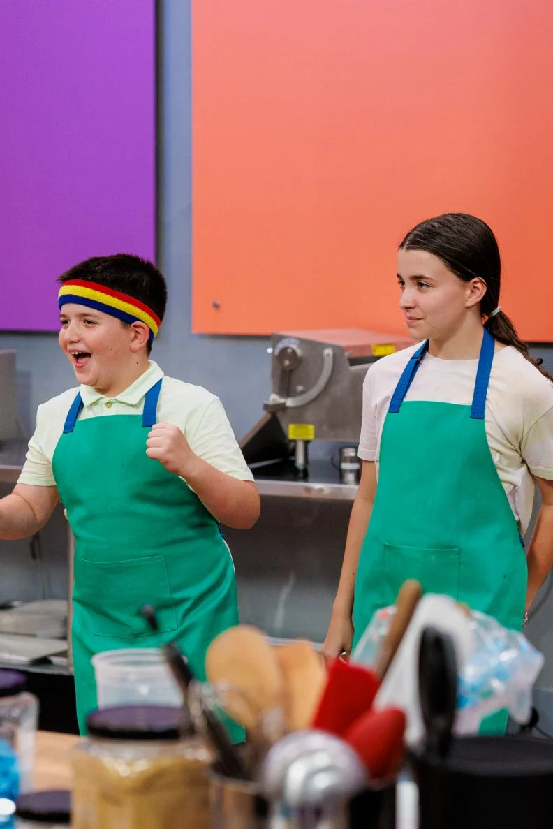 Contestants Cameron and Abby Bellezza win the dance off challenge, receiving 5 extra minutes on their bake, as seen on Baking Championship: Next Gen, Season 1.