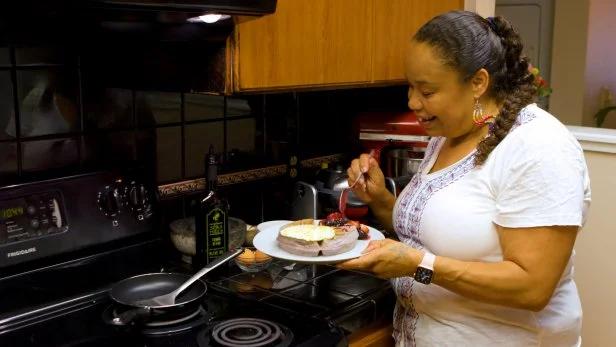 Crystal Wahpepah plating food and smiling, as seen on Crack an Egg With.