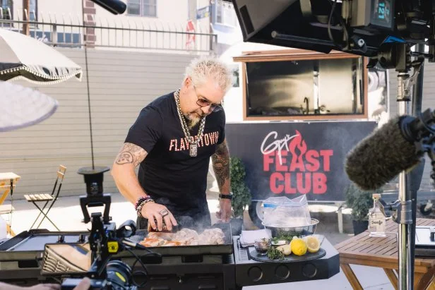 Guy Fieri cooking for Tony Hawk