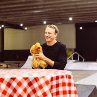 Tony Hawk on set for GFC holding a chicken