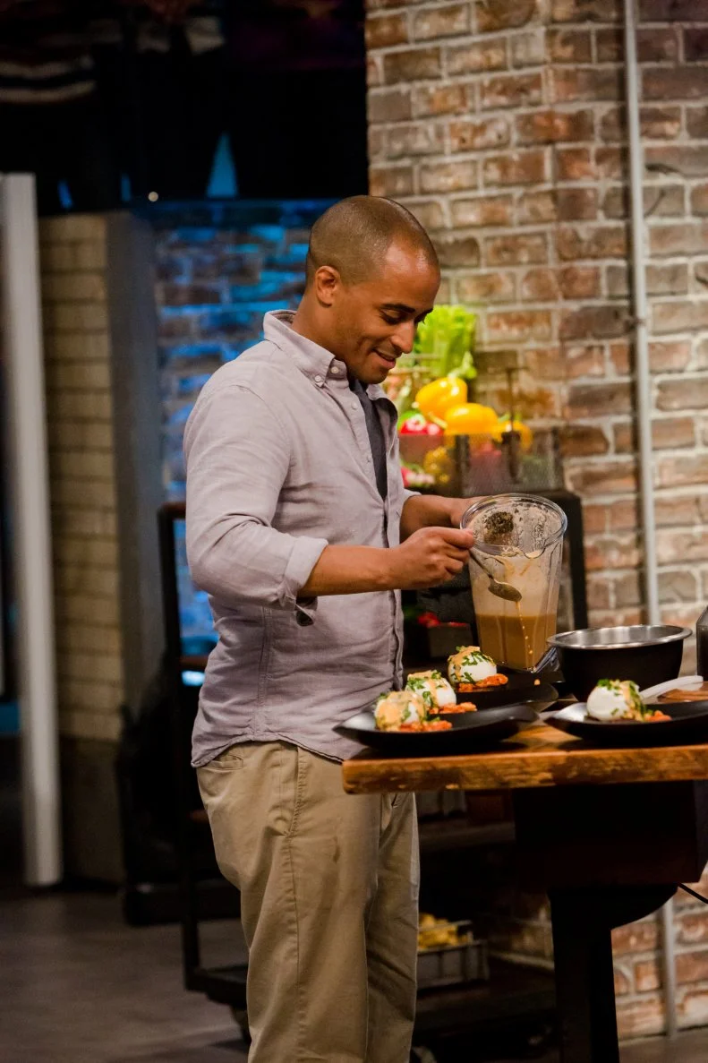 Contender Michael Jenkins drizzles sauce on his round one dishes, as seen on Food Network's Beat Bobby Flay, Season 3.