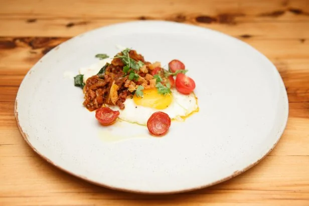 Contender Pablo Zitzmann's Andouille Sausage Ragu with Fried Egg, Cruncht Sausage and Kale, as seen on Beat Bobby Flay, Season 20.