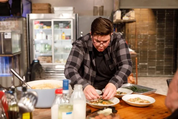 Contender Britt Rescigno adds the finishing touches to her Round 2 dish, as seen on Beat Bobby Flay, Season 30.