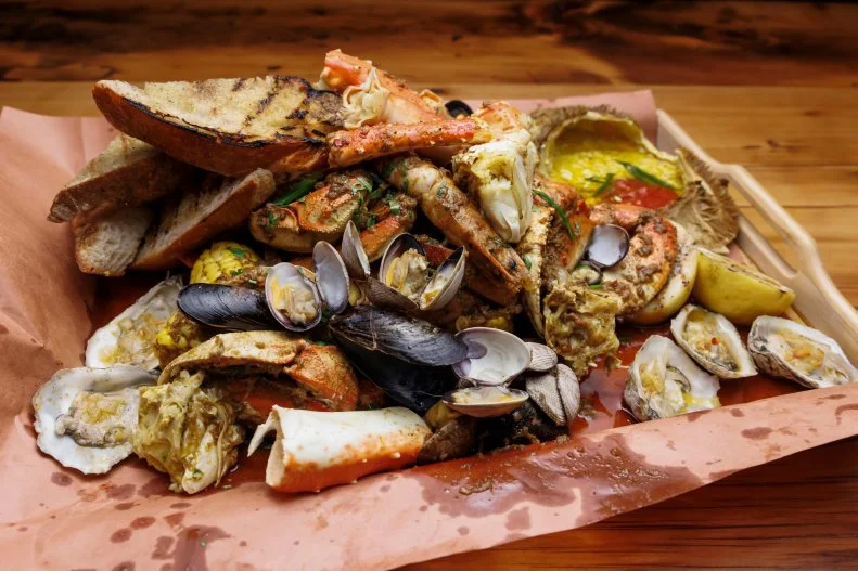 Contender Kaleena Bliss' Northwest Dungeness Crab Boil with Crab Butter and Cocktail Sauce, as seen on Beat Bobby Flay, Season 36.