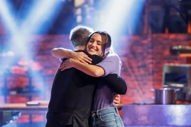 Chef Bobby Flay hugs contender Mika Leon after her win, as seen on Beat Bobby Flay, Season 39.