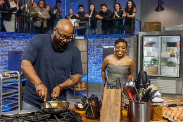 Co-host Quinta Brunson checks in with contender Devan Cunningham during Round 1, as seen on Beat Bobby Flay, Season 40.