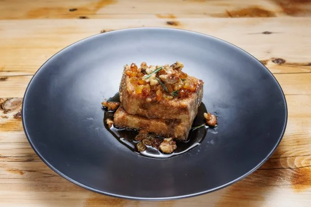 Contender Devan Cunningham's Mascarpone-Stuffed French Toast, Golden Raisin Syrup and Rosemary Walnuts, as seen on Beat Bobby Flay, Season 40.