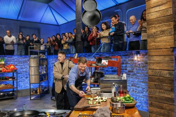 Co-host Michael Voltaggio tries to slow down chef Bobby Flay during Round 2, as seen on Beat Bobby Flay, Season 40.