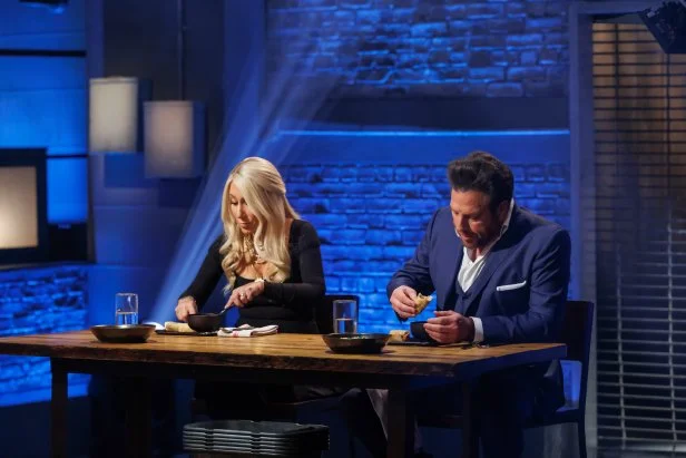 Co-hosts Lori Grenier and Scott Conant taste the Round 1 dishes, as seen on Beat Bobby Flay, Season 40.