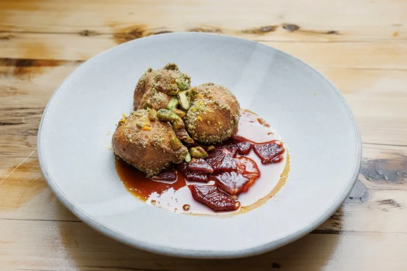 Contender Brooke Williamson's fennel-dusted pistachio zeppole with candied pistachios and blood orange caramel, as seen on Beat Bobby Flay, Season 41. 