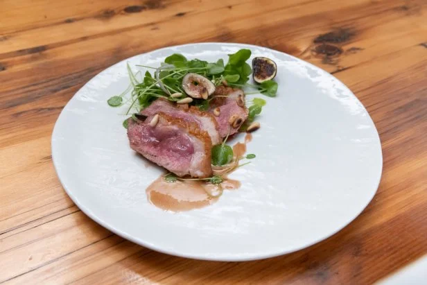 Contender Leah Cohen's Seared Duck Breast with a Fig Demi Sauce and a Watercress Fig Salad, as seen on Beat Bobby Flay: Holiday Throwdown.