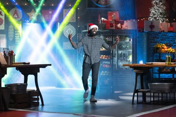 Contender Eric Adjepong enters Kitchen Stadium, as seen on Beat Bobby Flay: Holiday Throwdown.