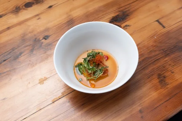 Contender Eric Adjepong's Pickled Herring Gyoza with a Ponzu Sauce and Toasted Sesame Salad, as seen on Beat Bobby Flay: Holiday Throwdown.