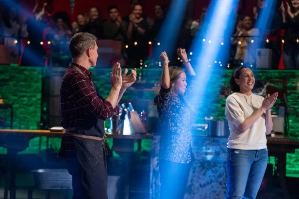 Chef Bobby Flay and contender Leah Cohen applaud contender Esther Choi's win, as seen on Beat Bobby Flay: Holiday Throwdown.