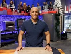 Contender Michael Jenkins poses at her station before Round 1, as seen on Beat Bobby Flay: Holiday Throwdown, Season 4.