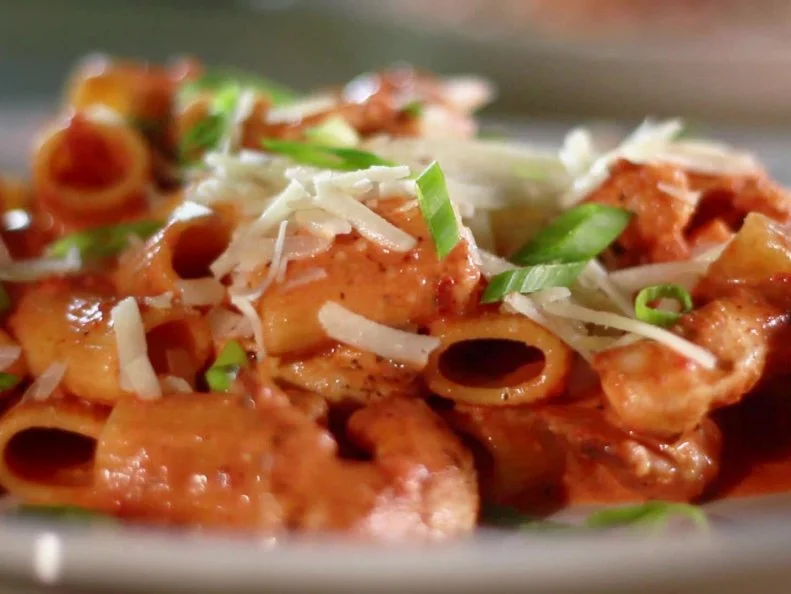 Spicy pasta with cherry peppers and chicken breast.