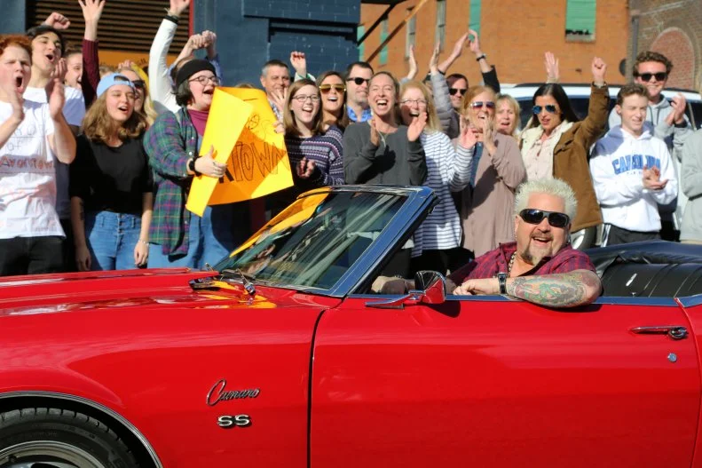 Host Guy Fieri Parking his Classic Chevy SS Camaro in Front of The Copper Penny in Wilmington, Noth Carolina as seen on Food Network's Diners, Drive-Ins and Dives: America's Favorites, season 1.